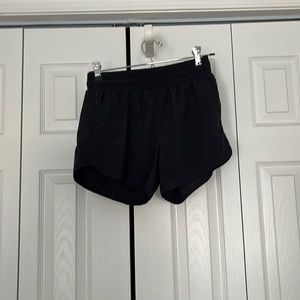 Black athletic Baleaf shorts with zipper pockets, worn once in awhile, size S